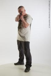 Yury Fighting Pose With Gun